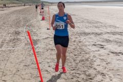 Sue-Ellen-Griffin-Mayo-Co-Secretary-who-finished-2nd-in-the-O35-Ladies-race-pounding-the-sand-on-Doolough-Beach